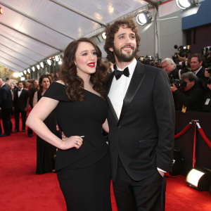 Kat Dennings and Josh Groban at Grammy Awards. Both in black formal attire. Red carpet scene