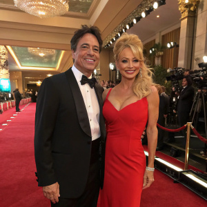 Scott Baio and Pamela Anderson at a glamorous awards ceremony.