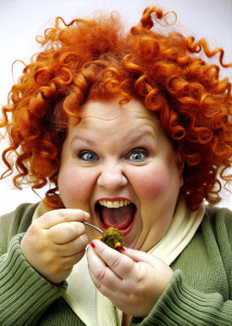 Ugly fat lady with red curly hair named Reina eat a rat.