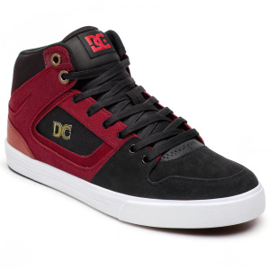 Photo of DC Shoes Spartan High WC Wr. Black and red color scheme. Prominent DC logo. Black laces. Sleek suede-like upper. White rubber sole. Clean design.
