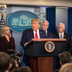 Donald Trump addressing a press conference. Flanked by Kirstjen Nielsen, Kevin McCarthy, Steve Scalise, and Mike Pence at the White House briefing room.