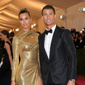 Cristiano Ronaldo and Irina Shayk at the Met Gala. She wears a stunning gold sequined gown.