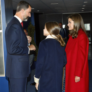 Princess Leonor, King Felipe VI, and Queen Letizia in animated discussion at the gala event.