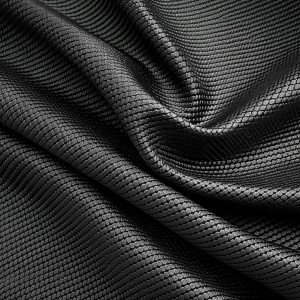 Pattern black carbon texture of the breathable fabric Detail of macro shot fabric texture