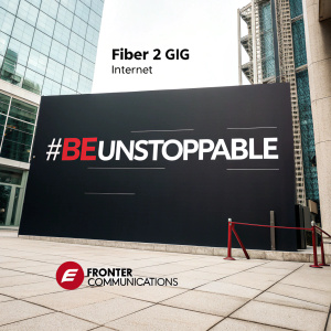 Frontier Communications unveils their latest Fiber 2 Gig Internet offer. #BeUnstoppable in bold, modern font. A sleek black background.