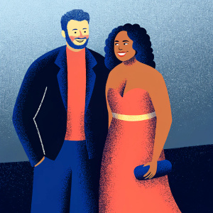 Sam Smith and Kanya King MBE posing together at the Brit Awards. Both smiling, gray background.