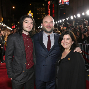 Ezra Miller, Rory Kinnear, and Lynne Ramsay at a bustling Hollywood movie premiere. Crowd of fans and paparazzi