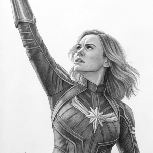 Detailed grayscale drawing of a female superhero, Captain Marvel. Pencil sketch. Dynamic pose, arm raised, determined expression.