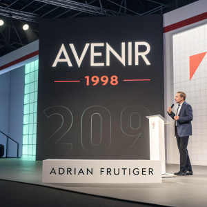 Adrian Frutiger showcasing his Avenir font design in a sleek, modern presentation. The year 1998 highlighted. Futuristic layout.