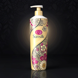 High contrast, sleek packaging design for Sunsilk shampoo. Brightly lit with dark background, showcasing intricate floral patterns.