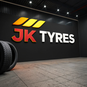 Modern logo for JK Tyres featuring bold, vibrant colors. The logo prominently displays the brand name in large, clear letters. Set against a sleek black backdrop, it creates a striking and memorable impression.