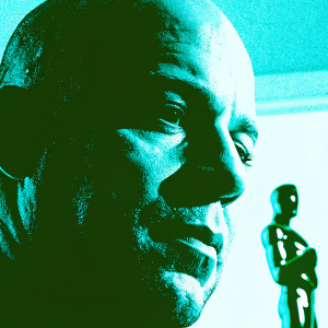 Close-up of Vin Diesel's face at an awards ceremony. Soft lighting, blurred audience in the background.