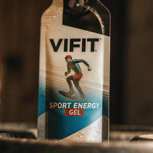 Packaging for Vifit Sport Energy Gel. Design showcases an athlete mid-run in vibrant colors - blue, white, and hints of red. Includes product details and barcode.