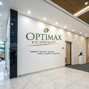 Optimax Eye Specialist clinic. Located in Taman Tun Dr Ismail, Kuala Lumpur, Malaysia. Specializing in comprehensive eye care including cataracts, glaucoma, and dry eyes. Modern graphic design featuring a clean white background with prominent branding.