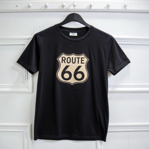 Vintage Route 66 logo on a sleek black t-shirt. Empty white backdrop.