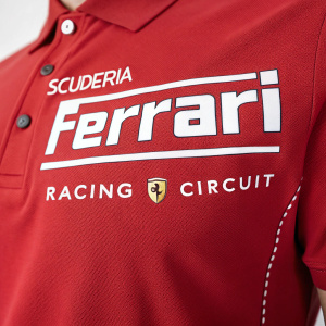 High-resolution image of a red Ferrari polo shirt. Close-up shot. White 'Scuderia Ferrari' logo and 'Racing Circuit' text prominently featured. Bold and vibrant design. White stitching contrasts with red fabric.