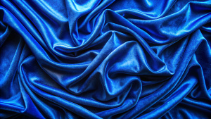 Fabric Texture Background: Velvet texture royal blue color background, expensive luxury fabric, material, wallpaper. Copy space.
