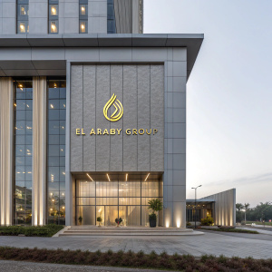 Stunning architectural shot of El Araby Group's headquarters. Gold logo stands out on sleek gray facade.