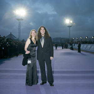 Suzanne Krajewski and 'Weird Al' Yankovic at a film festival. Purple carpet and flashing lights