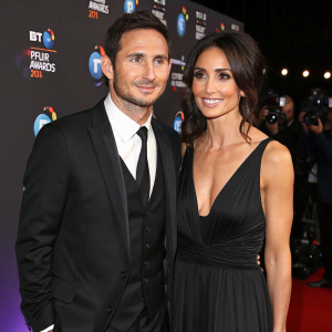Frank Lampard and Christine Bleakley at the BT Sport Awards. Frank in black suit, Christine in black gown with deep V-neck. Dark backdrop with flashing cameras, ITV logo visible.