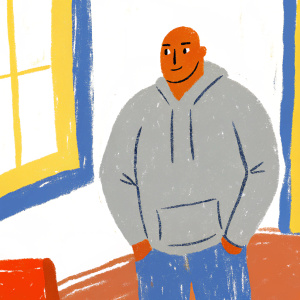 Mario Williams, former NFL player, in a casual outfit. Gray hoodie and jeans. Indoors, minimalistic setting.