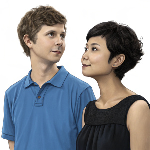 Studio portrait of Michael Cera and Charlyne Yi. Plain white background. Michael Cera in a blue polo shirt, Charlyne Yi in a simple black dress.
