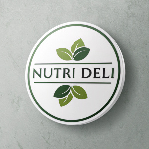Nutri Deli's logo redesign. Modern, circular emblem with green leaf motif. Sleek and stylish