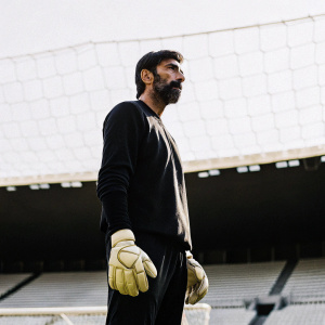 Gianluigi Buffon, goalkeeper, intense gaze, training in an empty stadium.