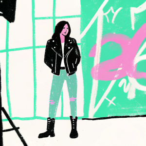 Selena Gomez on the set of a pop music video. Wearing a black leather jacket, ripped jeans, and combat boots. Stylized graffiti background.