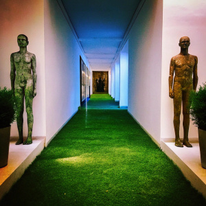 At an art exhibit, Kiki Smith's sculptures, 'Caresaren Rapture' and 'Eutocia Born', stand as eerie sentinels, blending human anatomy with the raw beauty of nature. Amidst dimly lit corridors, the works tell silent stories, secrets only the artist can reveal.