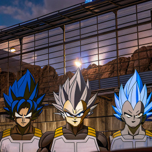 Blue-haired Goku, Vegeta, and Gogeta, with fierce determination, stand side by side in the Dragon Ball universe.