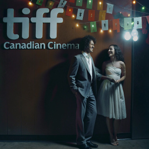 Adrian Murray and Molly Reisman at TIFF, celebrating Canadian cinema. Festive backdrop with vibrant logos and text