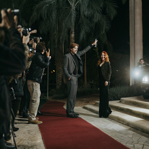 Robert Pattinson and Isla Fisher at the star-studded premiere. Red carpet bustling with paparazzi and fans.
