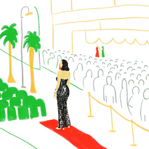 Angela Bassett at Cannes Film Festival. Wearing a black sequined gown. Crowded street in background