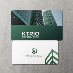 KTrio Construction's business cards: top card showcases a green backdrop with sleek architectural lines and logo. Bottom card features white background with CEO Jasmine Cantos's name and logo.