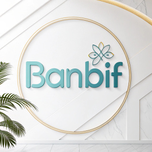 Modern logo for BanBif featuring clean lines and simple font in light blue. Set against crisp white background with subtle gold highlights