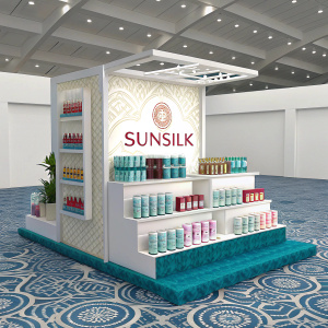 3D model of a Sunsilk booth at a beauty expo. Multiple tiers showcasing Sunsilk products. Blue patterned flooring. Clean white backdrop.