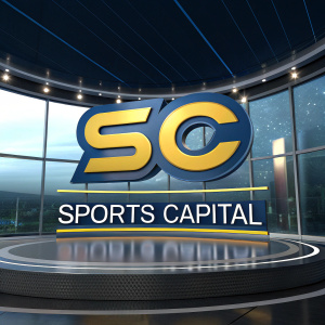 3D logo for Sports Capital, a TV show combining sports and finance news. Logo design features 'SC' in blue and yellow. Set against sleek, curved glass background with ambient lighting.