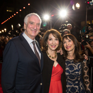 Jim Cameron, Domenica Cameron-Scorsese, and Illeana Douglas attending the opening night of a major film festival. Bright lights and paparazzi in the background.