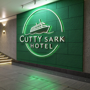 Cutty Sark Hotel's modern logo on vibrant neon green backdrop. The logo design resembles a sleek metallic ship, illuminated and eye-catching.