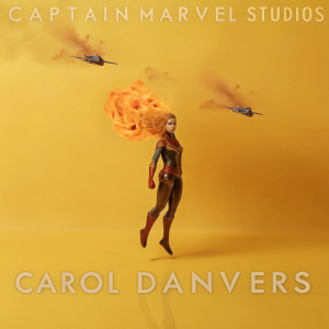Digital illustration of Carol Danvers, Captain Marvel. Dynamic pose with fiery hair, focused expression. Set against a dramatic fiery backdrop with futuristic battle scene elements. Marvel Studios logo at the top, rich color palette
