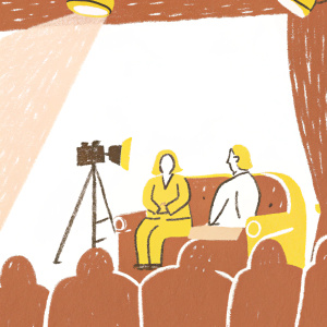 Jonah Hill in an interview setup. Seated on a couch opposite Jay Leno. Studio audience present.