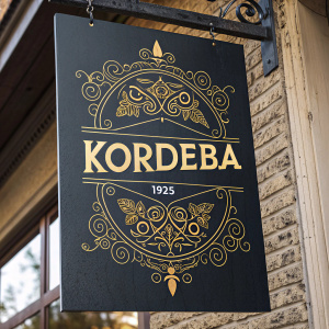 Promotional poster for KordEba, the historic black ink studio and design service. Established 1925. Dark background, gold accents, rich, vintage aesthetic. Ornate design with prominent text. Rustic, textured backdrop. Dark tones with gold highlights.