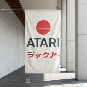 Atari's promotional banner, featuring the iconic logo and text in Japanese, set against a minimalist background.