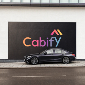 Cabify logo in sleek modern font, vibrant colors, plain background