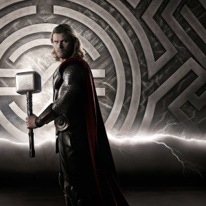 Chris Hemsworth as Thor, intense expression, in a high contrast black and white photo, standing in front of an abstract patterned background. Promotional material for Marvel movie