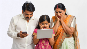 Modern worried indian Parents with kid using tab 