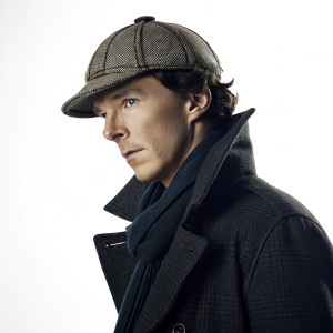 3D rendering of Benedict Cumberbatch as Sherlock Holmes. Poses in front of a simple white backdrop. Wearing iconic deerstalker hat and coat from BBC series Sherlock. Dark, moody lighting