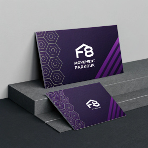 Business cards for F8 Movement Parkour. Organized in an elegant display. Dark purple and black color scheme. Modern and sleek design. Professional and contemporary feel.