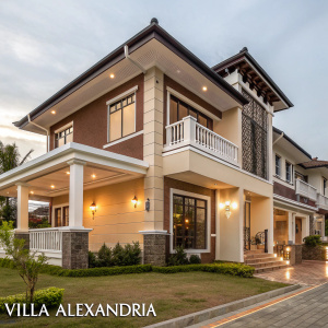 Luxury modern villa with sleek design, located in Bacolod City. Features brown and beige hues, spacious balcony with white railings. Blends contemporary and traditional architectural styles. Villa Alexandria, premium properties website.